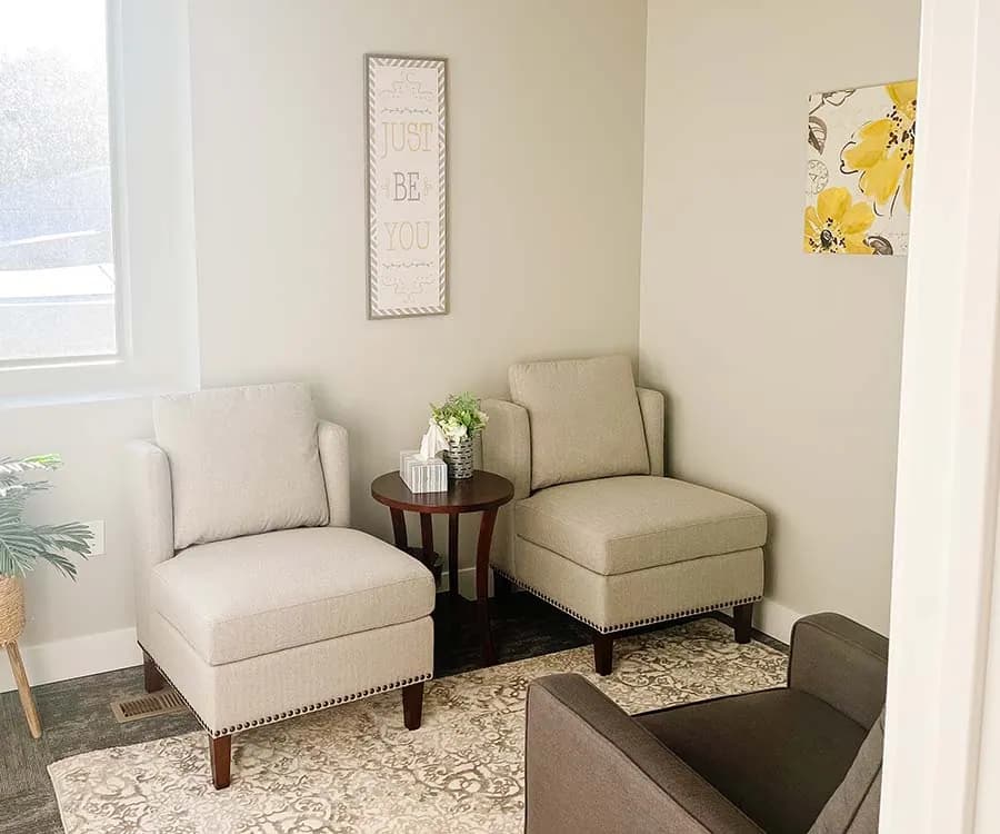 A Mountain View Family Therapy room with cream armchairs